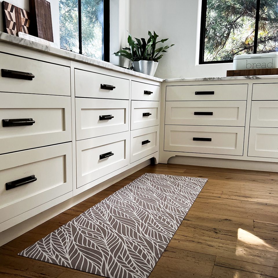 Abstract cream colored leaf pattern on shiitake tan linen look low profile washable floormat