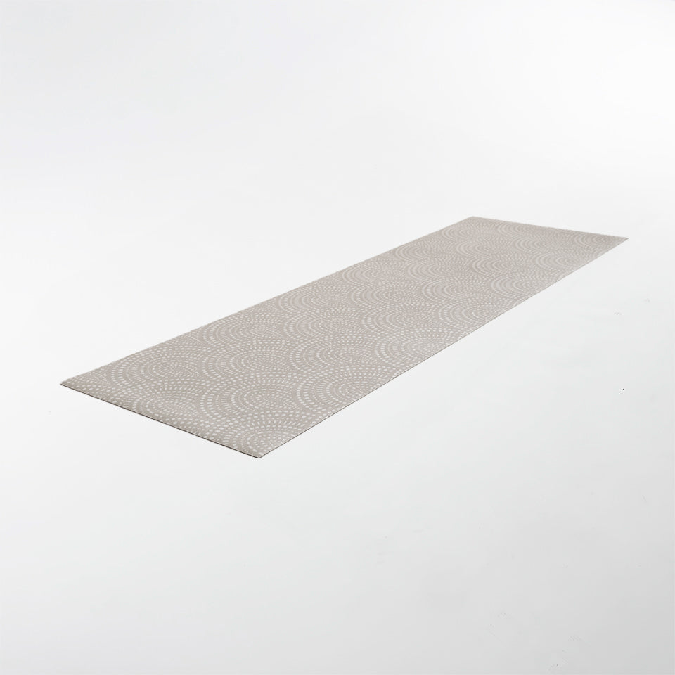 Indoor hallway runner sized floormat in Shiitake tan colored linen background with white dotted fan design on a low profile washable floor mat