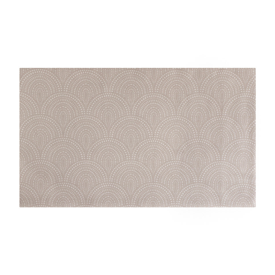 Overhead shot of Shiitake tan colored linen background with white dotted fan design on a low profile washable floor mat in medium