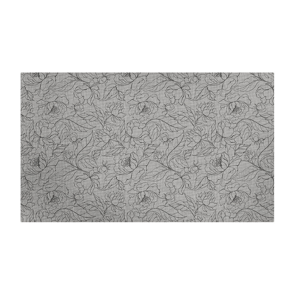 Un-Rug's Fine Line Floral mat with a linear floral design in dark brown on a beige background.