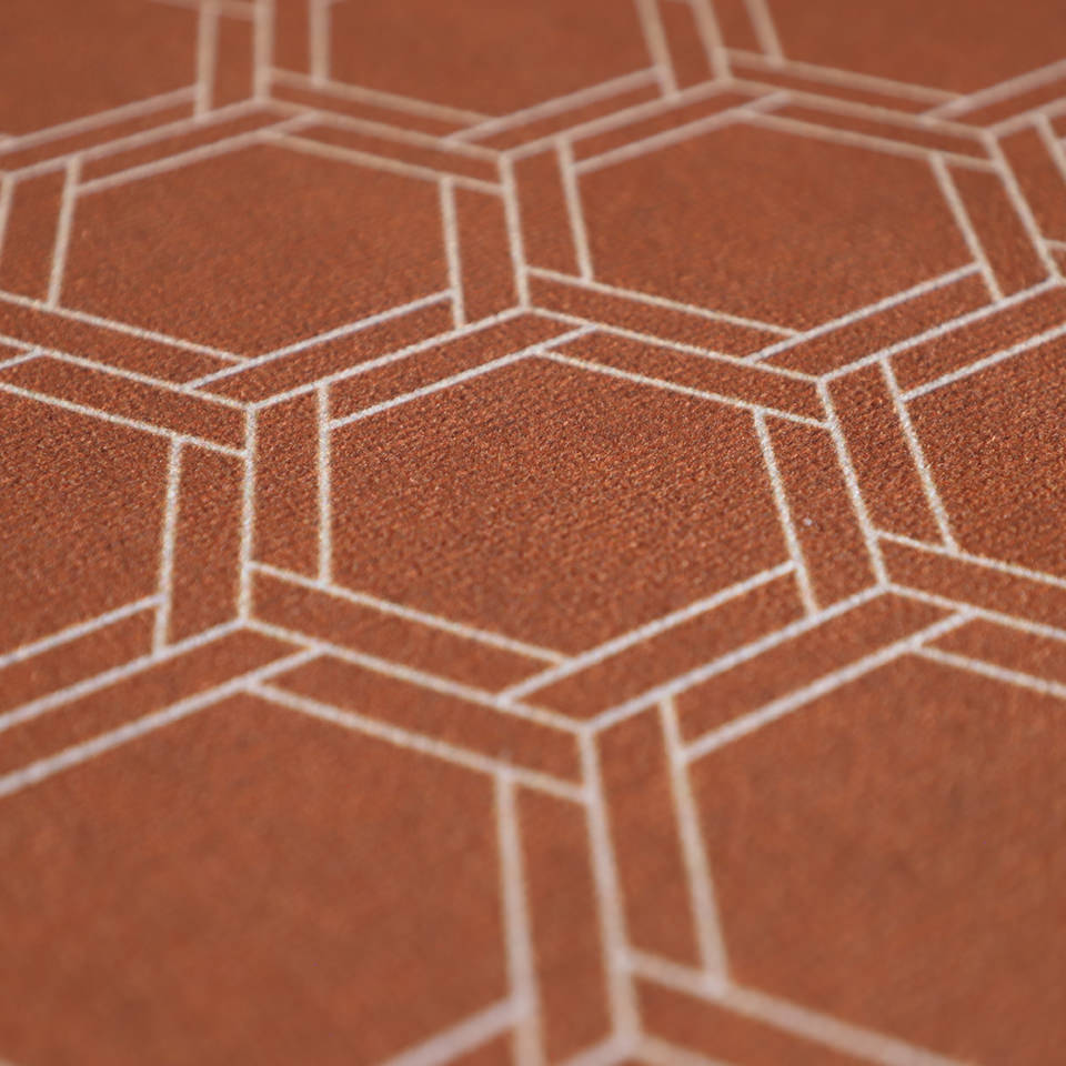 Close up of low profile washable floor mat in burnt orange linen look with double honeycomb accent design in shiitake tan