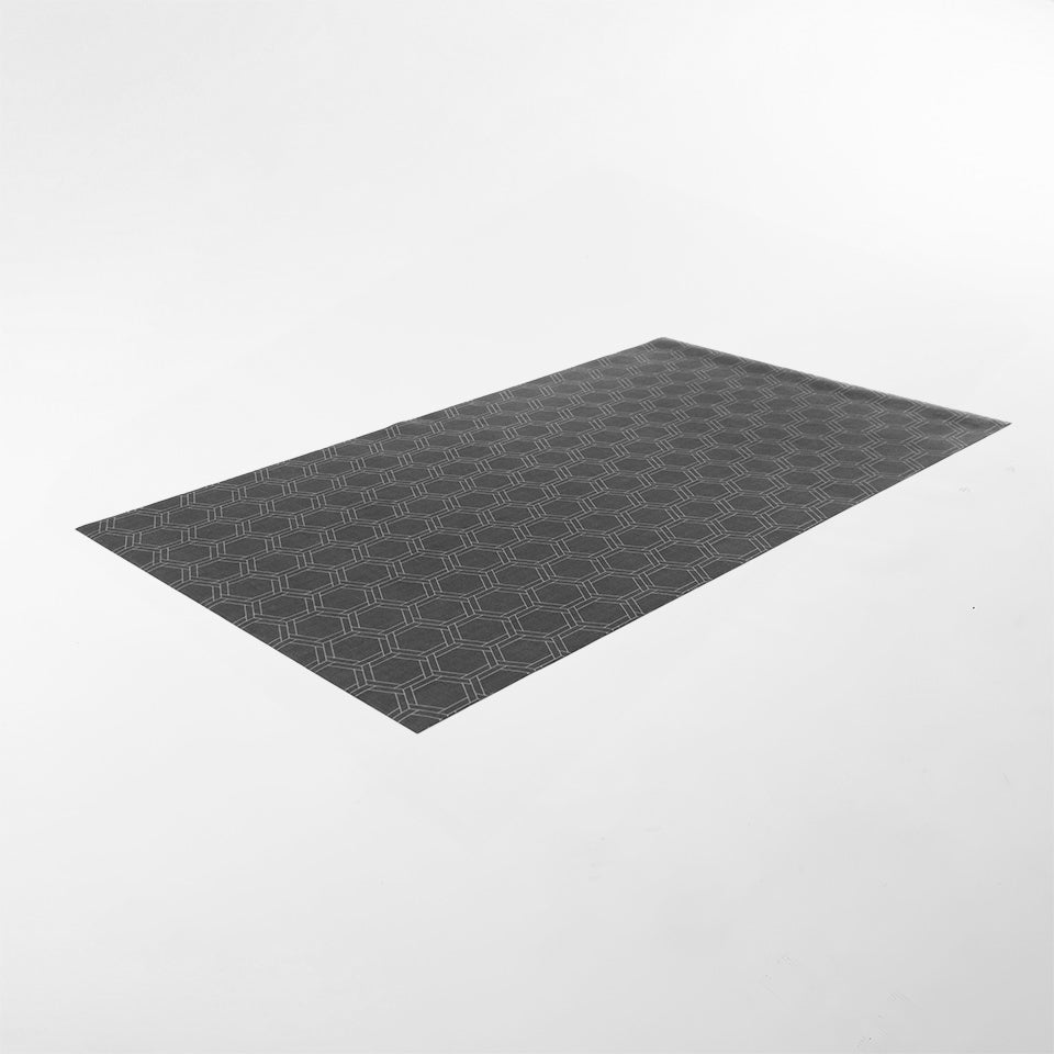 Angled overhead shot of Urbane Bronze brownish linen look with double honeycomb accent design in shiitake tan printed on a low profile washable indoor floor mat