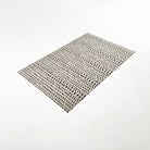 Angled overhead image of Un-Rug's Indigenous Dots in the size small.