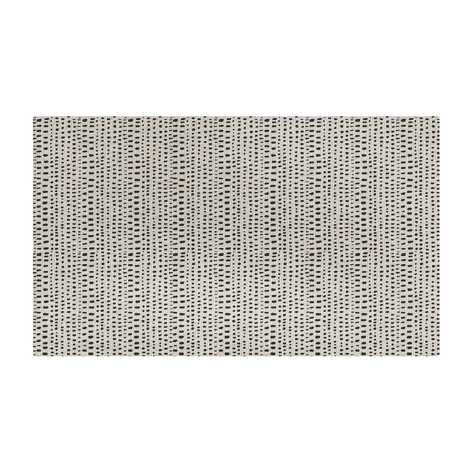 Overhead of Un-Rug's indigenous Dots mat with various sized, linear dots on a cream background.