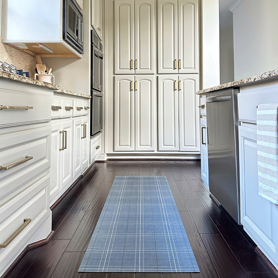 Decorative Un-Rug interior runner mat in blue protecting the floors in the kitchen.