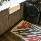 Low-profile MCM Flower earthen jug in a laundry room protective the floors from water and spills