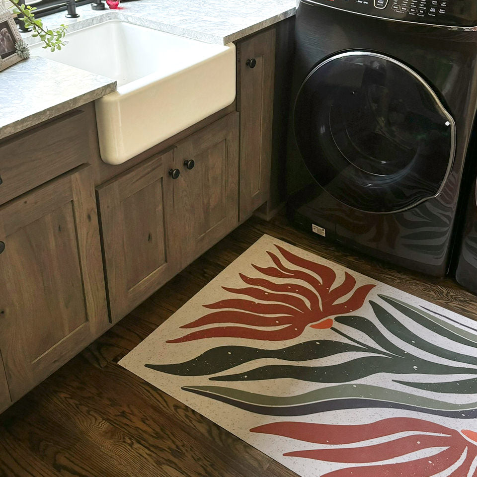 Low-profile MCM Flower earthen jug in a laundry room protective the floors from water and spills