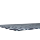 Super low profile view of Sea salt organic line abstract design on dark storm cloud blue background printed on a thin low profile machine washable floor mat for indoor use.