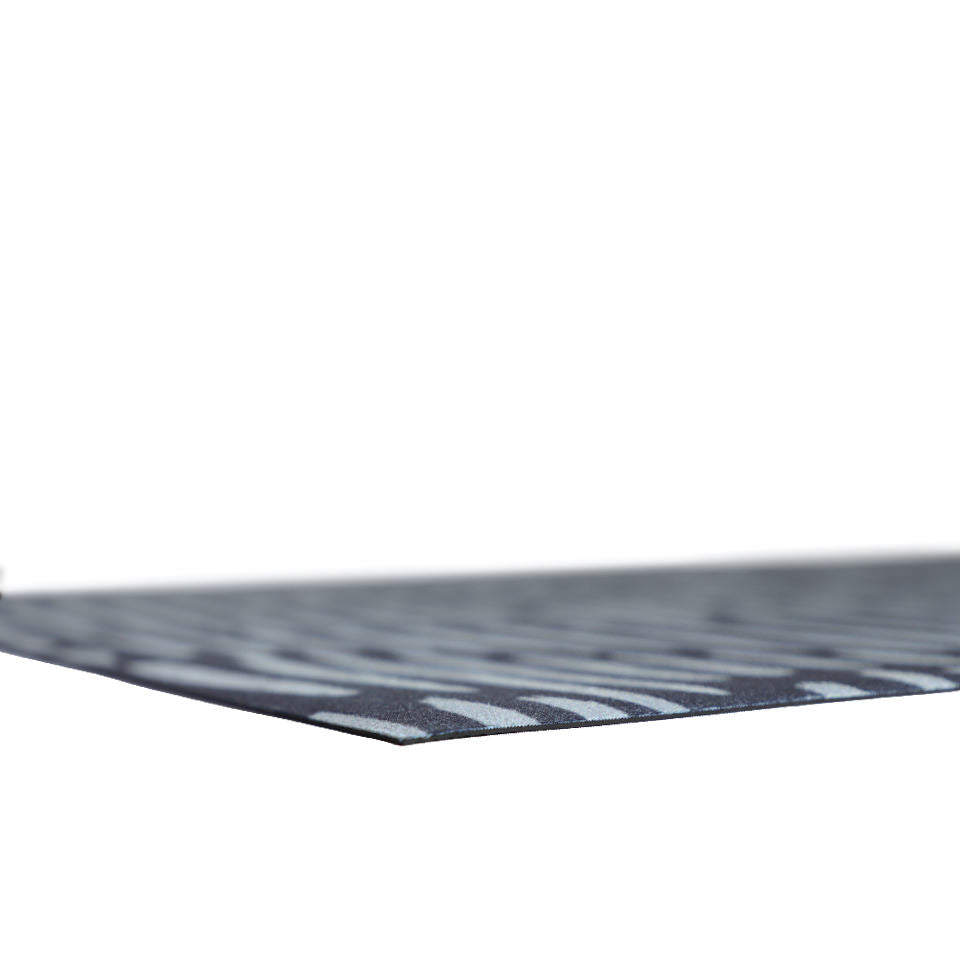 Super low profile view of Sea salt organic line abstract design on dark storm cloud blue background printed on a thin low profile machine washable floor mat for indoor use.