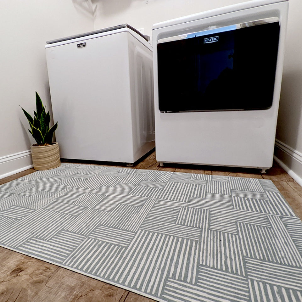 Sea Salt blue with snowbound cream colored organic lines in abstract square pattern low profile washable interior accent rug.