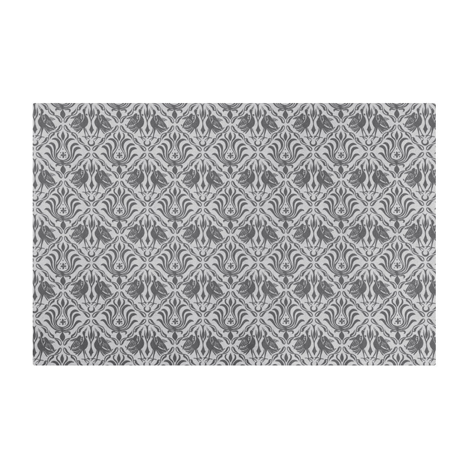 Overhead of Urbane bronze ornamental cranes in damask pattern printed on shiitake tan; washable low profile indoor small mat