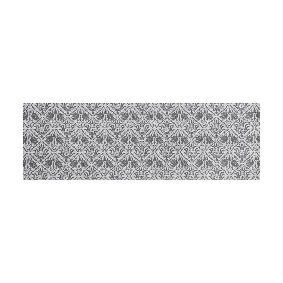 Overhead of Urbane bronze ornamental cranes in damask pattern printed on shiitake tan; washable low profile indoor runner mat