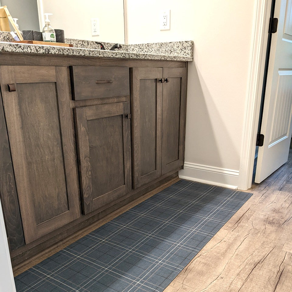 Storm Cloud blue printed linen texture with shiitake tan and urbane bronze plaid stripes on a low profile washable indoor floor mat