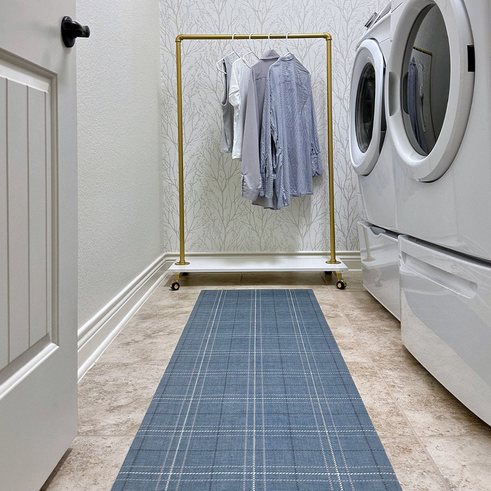 Machine-washable Un-Rug runner mat in a laundry room in the Oslo Plaid design.