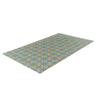 Overhead angled shot of 3x5 floor mat.  Neutral kaleidoscope pattern in aquas, apple green, and hints of orange on this low profile washable interior floor mat.
