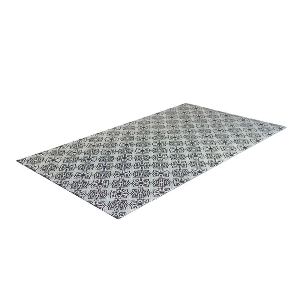 angled view of beautiful UnRug in classic porto geometric architectural design in black white and light teal