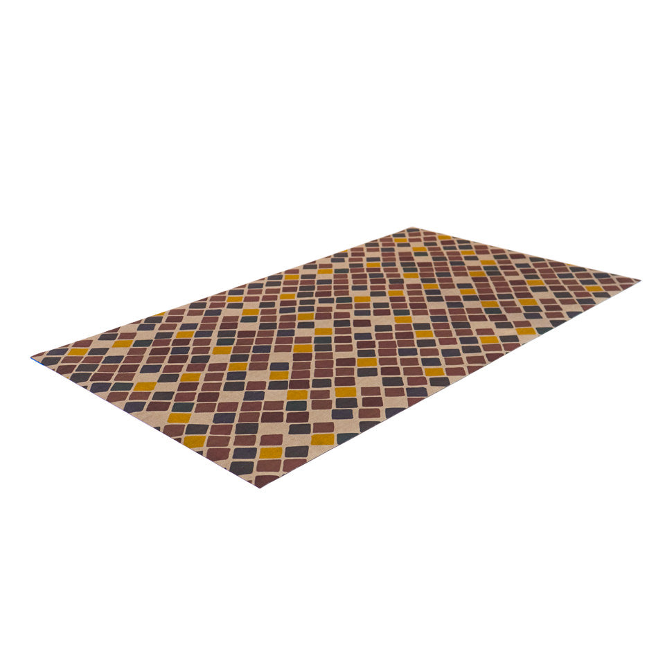 angled view of beautiful unrug mat covered in tiny squares in multiple colors, dark red, yellow, dark brown, and neutral beige