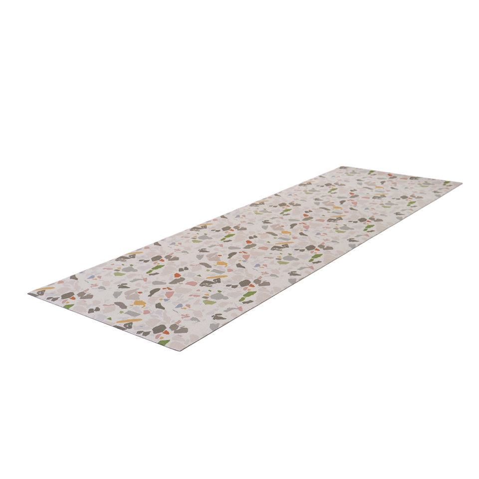angled UnRug runner mat in terrazo (neutral background with multi colors)