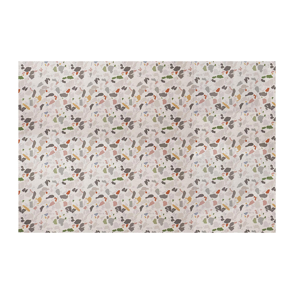 overhead view of rectangular mat with light neutral background and terazzo pattern in multi colors