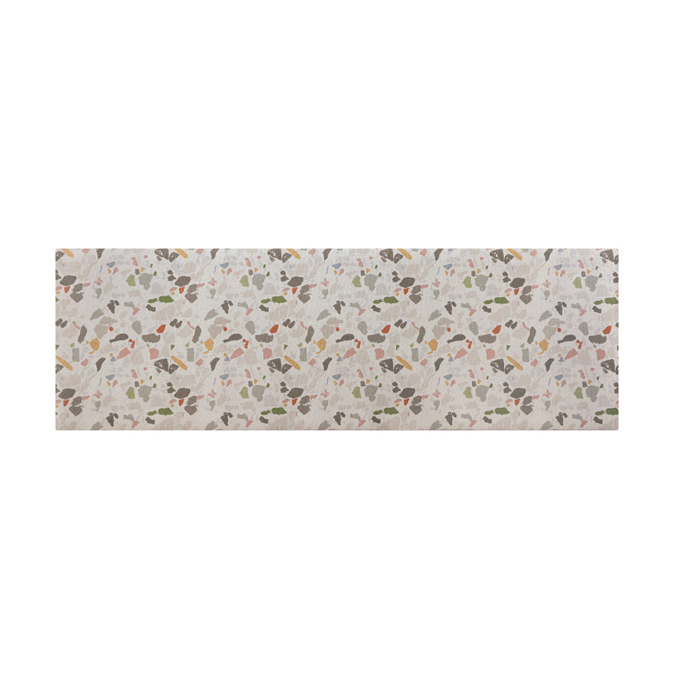 overhead view of long runner mat with light neutral background and terazzo pattern in multi colors