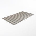 angled rectangular mat with vertical stripes and pinstripes in beige (shiitake) and earthy green
