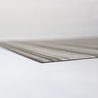 close up corner of extremely thin rubber mat with soft fabric surface
