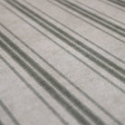 close up of soft fabric with beige and green stripes