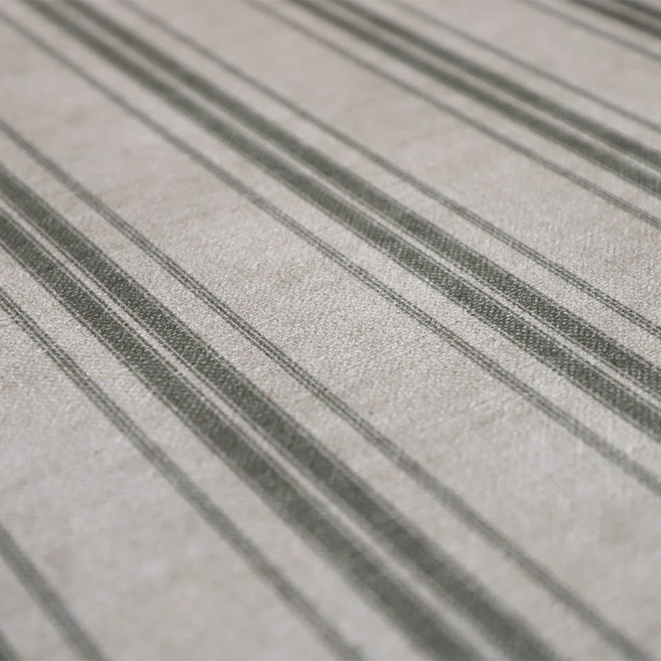 close up of soft fabric with beige and green stripes