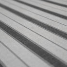 close up of fabric surface with wider stripes and pinstripes in neutral tones