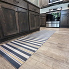 Ticking stripes in navy blue storm cloud with mustard yellow tassel stripes on an indoor washable kitchen runner