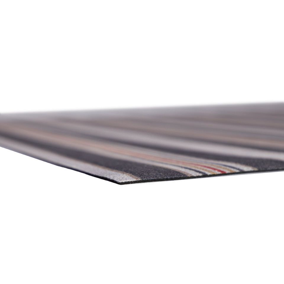 corner of very thin, low-profile rubber mat with soft fabric surface