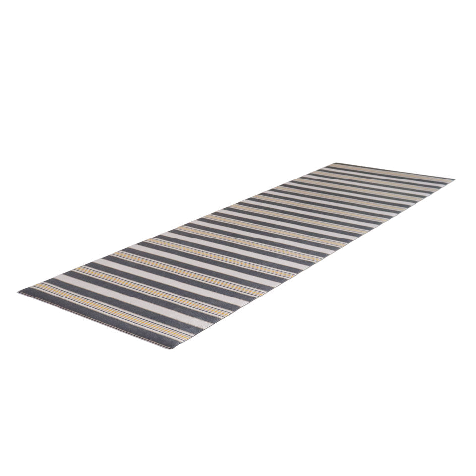 long, thin, flat, low-profile UnRug with stripes in multi-widths and multi-colors, rock bottom and tassel
