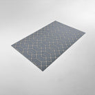Overhead angle image of Un-Rug's Timeless Trellis accent mat in the size small.