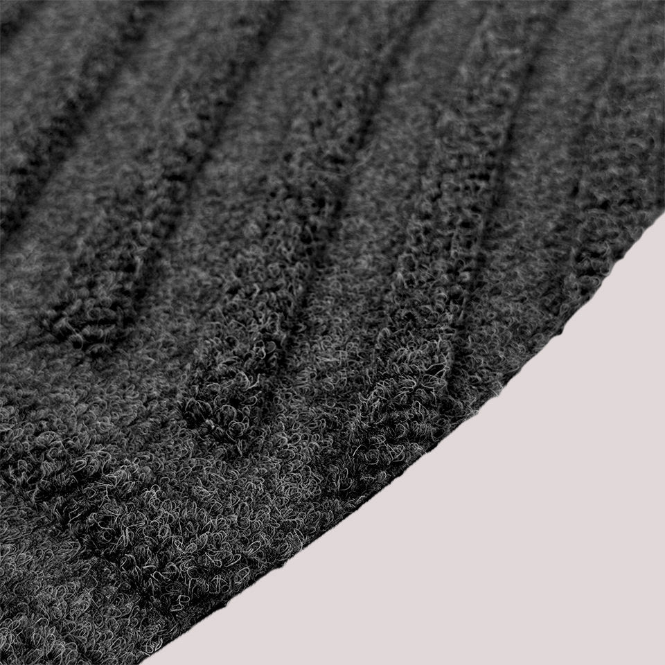 Surface detail image of WaterHog Luxe’s Heartland bi-level design and eco-friendly fabric in graphite.