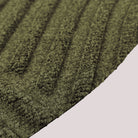Surface detail image of WaterHog Luxe’s Heartland bi-level design and eco-friendly fabric in olive.