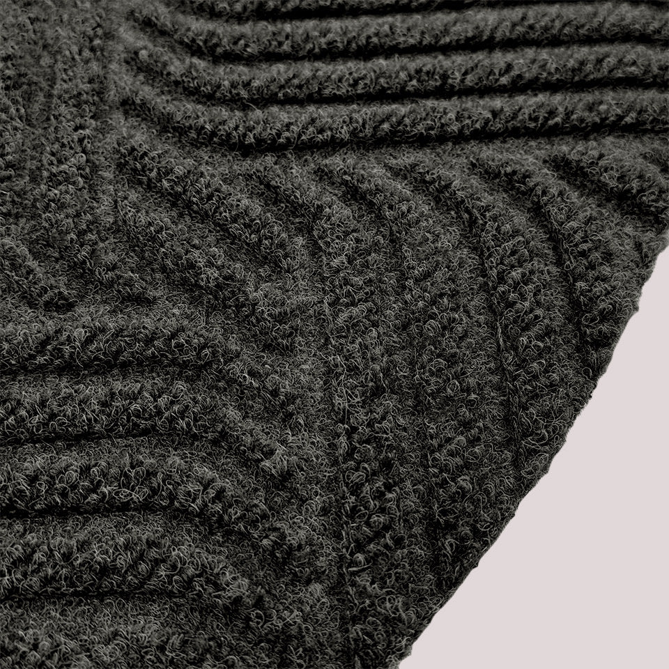 Surface detail image of Heymaker’s bi-level linear design and eco-friendly fabric construction in graphite.