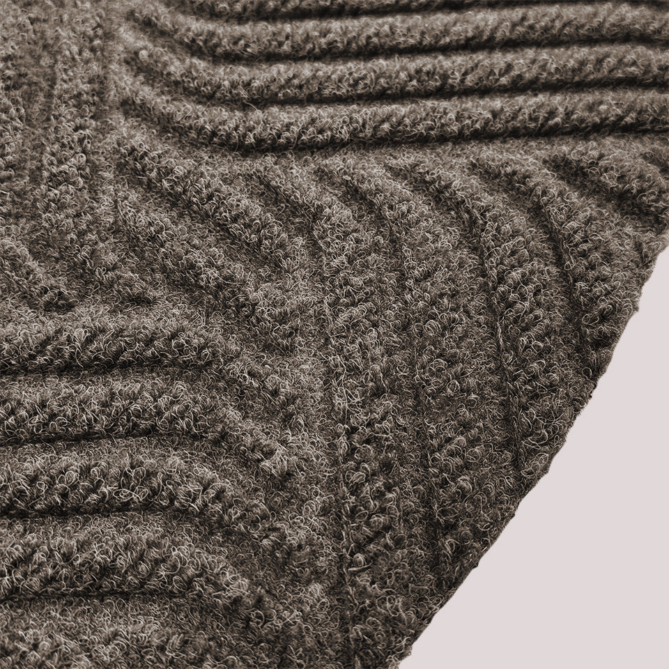 Surface detail image of Heymaker’s bi-level linear design and eco-friendly fabric construction in greige.