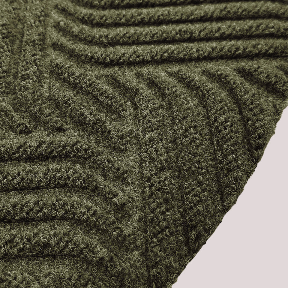Surface detail image of Heymaker’s bi-level linear design and eco-friendly fabric construction in olive.