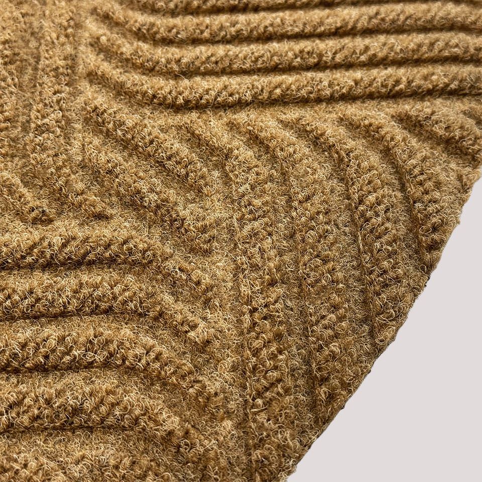 Surface detail image of Heymaker’s bi-level linear design and eco-friendly fabric construction in wheat.