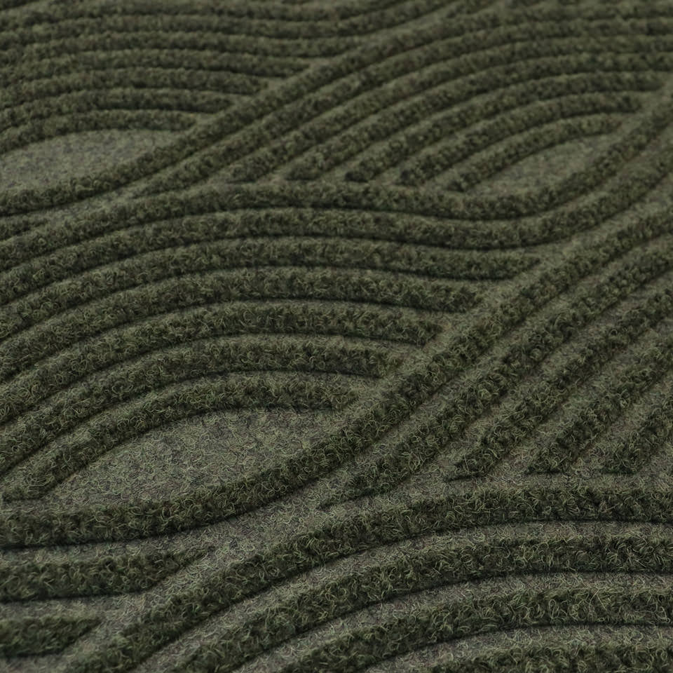 Close-up image of Waves’ bi-level non-shedding surface material in olive.