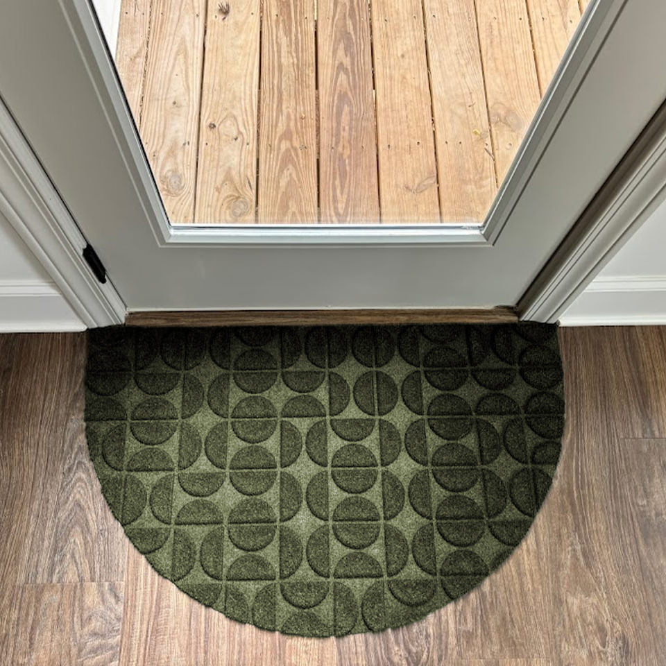 WaterHog Luxe all-weather half round doormat at a decks door entrance.