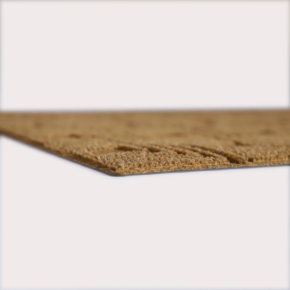 Profile corner image of the Labyrinth doormat in wheat, showing the overall 3/8” height and rubber backing.