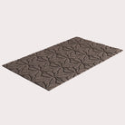 Angled image of the single-door Magnolia mat in the color greige on a creamy white background.