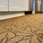 Low-profile WaterHog Luxe all-weather kitchen mat double door along a kitchen island.