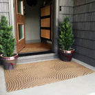 3'x5' WaterHog Luxe all-weather doormat shown in the Put Your Records On design in wheat color placed at a mid-century modern front door.