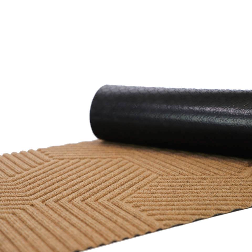 Rubber backed doormat in zephyr geometric pattern. Wheat colored bi-level doormat for indoor and outdoor use.