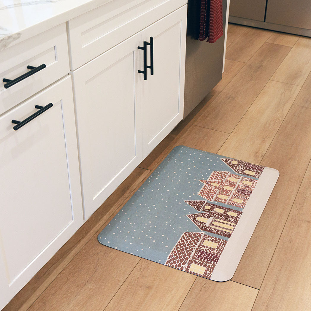 Gingerbread House Christmas anti-fatigue kitchen mat with wipeable surface and winter holiday design for kitchen comfort.