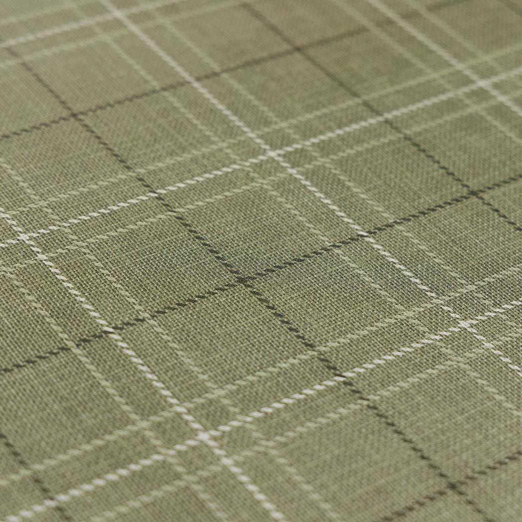 Close up detail of classic green plaid anti-fatigue kitchen mat with wipeable surface and neutral design for kitchen comfort.