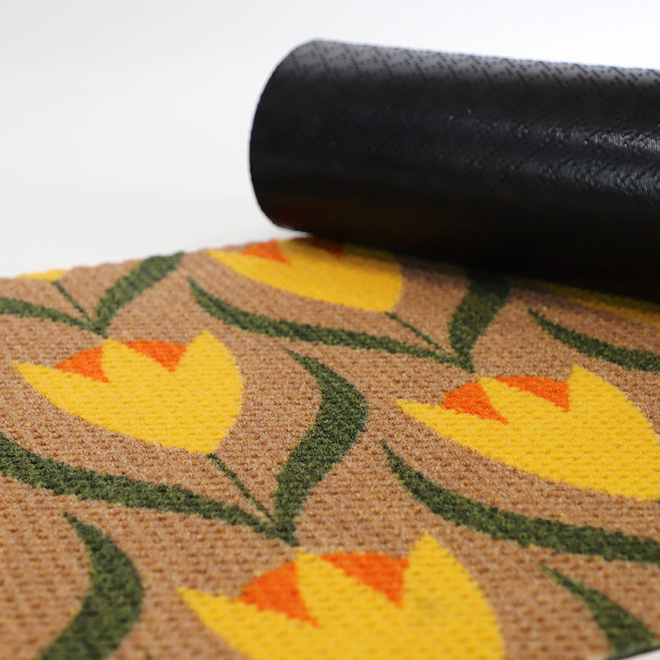 coir and yellow buttercups doormat with corner rolled to show rubber textured backing