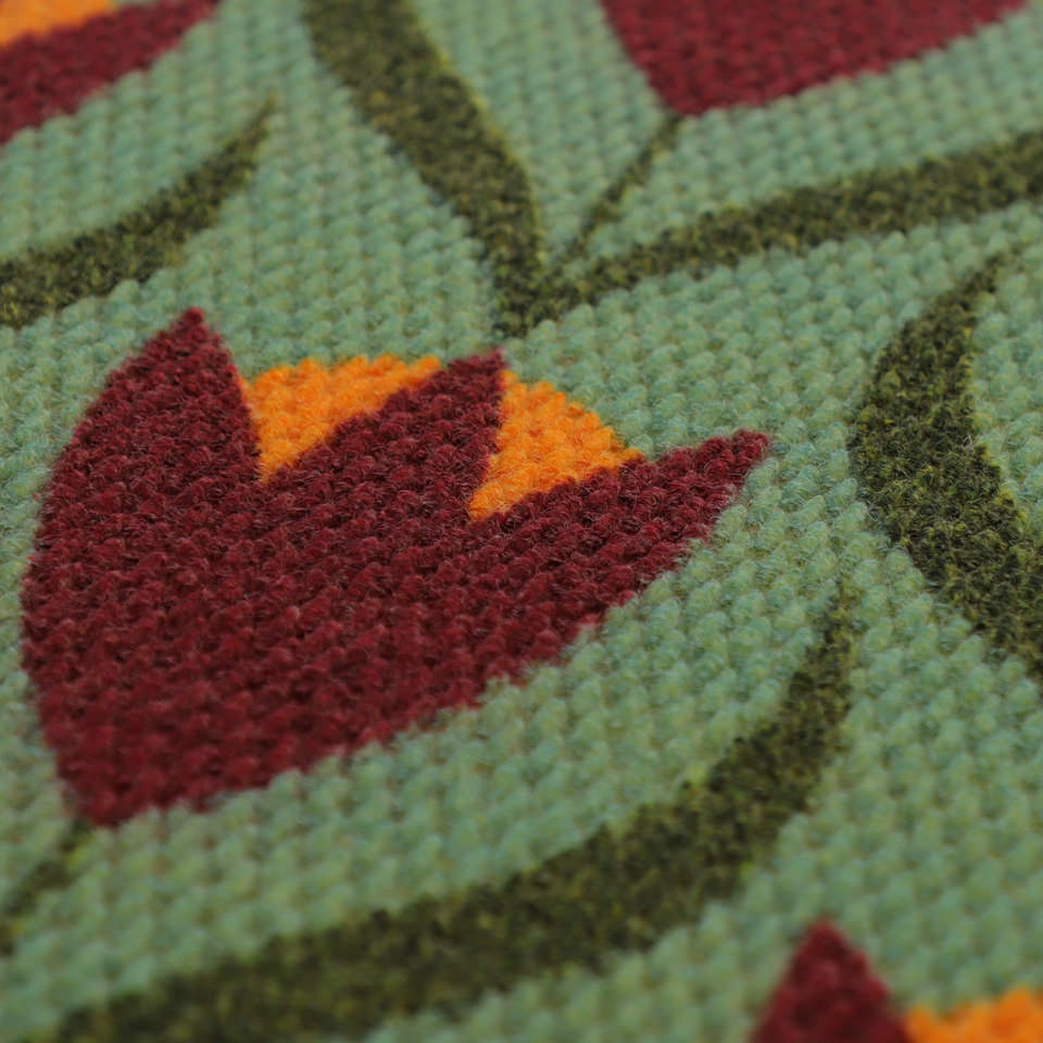 close up of green and berry (deep red) buttercups pattern